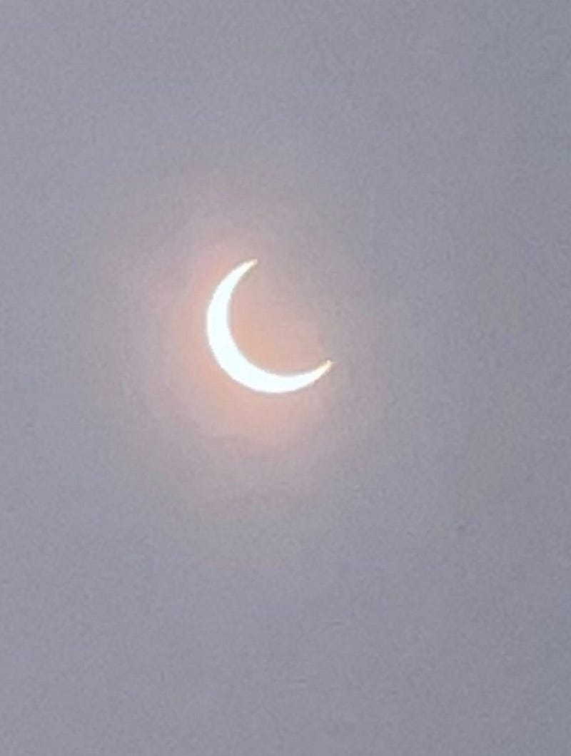 Crescent Sun viewed through eclipse glasses.